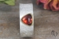 Preview: Ring Raeka, Silber 925/-  mit dreieckigem Granat-Cabouchon